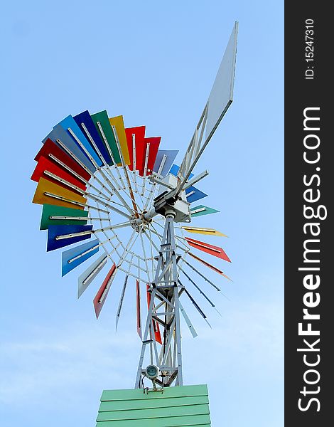 Colorful windmill in blue sky