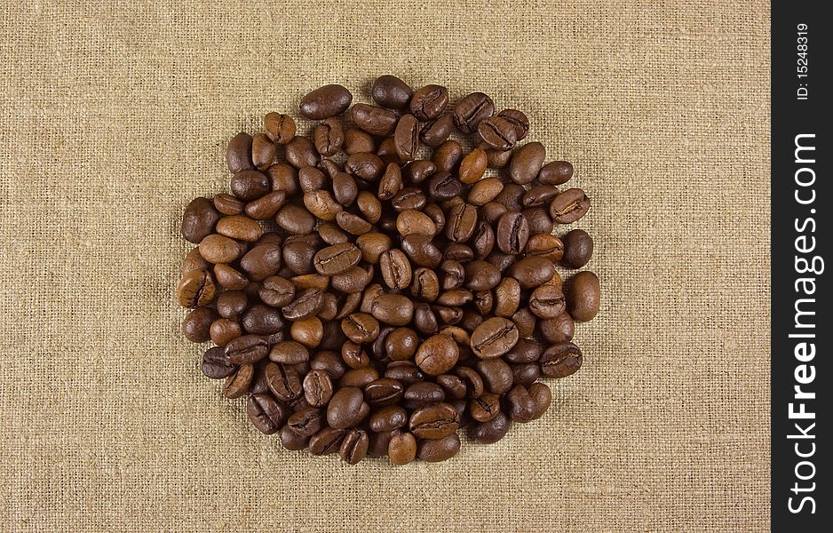 Close-up of coffee beans on a fabric background