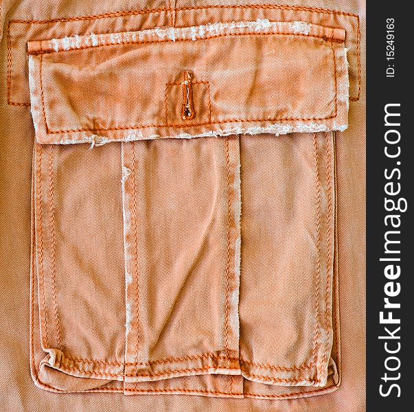 An orange pant's pocket as a background