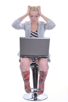 Woman With A Laptop And Sticks To Hands For A Head Royalty Free Stock Photography Woman With A Laptop And Sticks To Hands For A Head Royalty Free Stock Photography