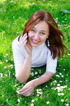 The Girl With The Phone On The Grass, Vertical Stock Photography