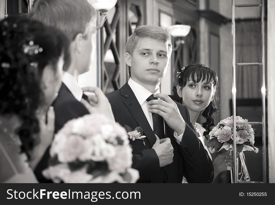 The bride and groom before the mirror. The bride and groom before the mirror