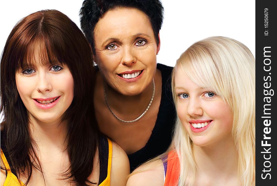 Blackhaired mother and one blond teenager and one brunette teenager girls portraits on white background. Blackhaired mother and one blond teenager and one brunette teenager girls portraits on white background