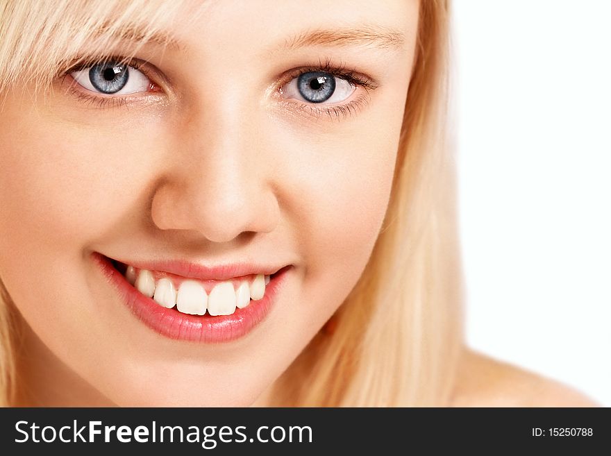 Beautiful natural girl face, close-up with blond hair ,copyspace and white background. Beautiful natural girl face, close-up with blond hair ,copyspace and white background