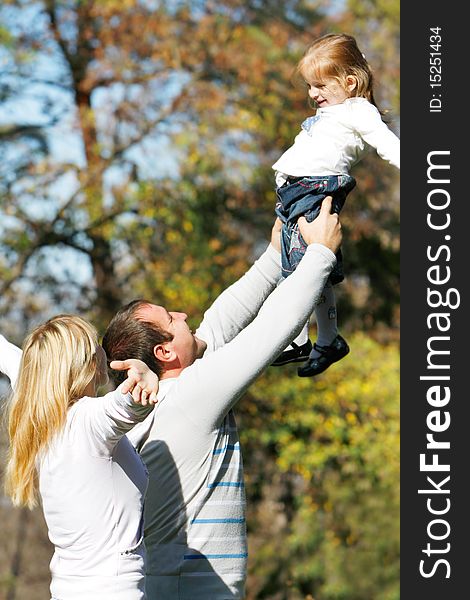 Happy family in autumn park. Happy family in autumn park