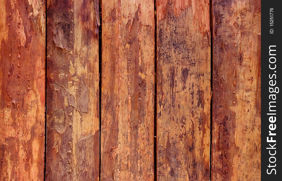 Red background of raw wooden boards