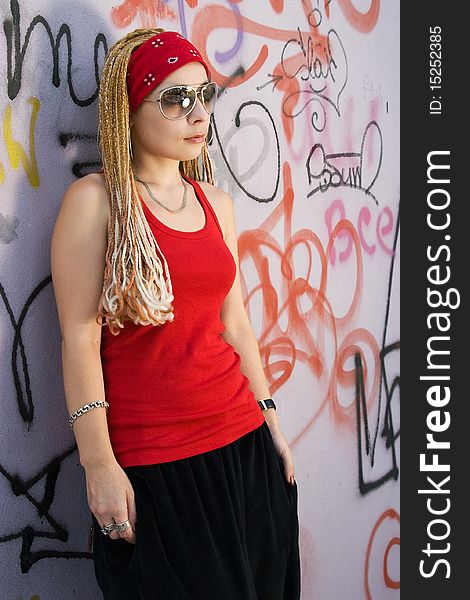 Rapper Girl Posing At Sprayed Wall