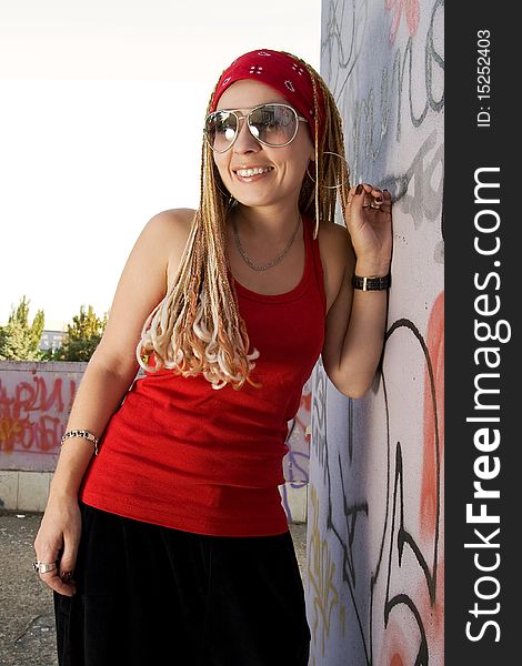 Hip-hop Styled Girl In Red Laughing Outdoors