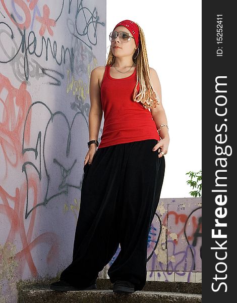 Rap-styled teen girl posing outdoors