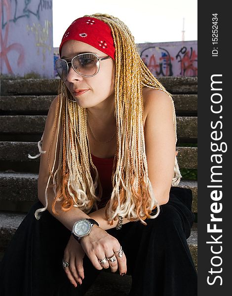 Late teenage girl with braids posing outdoors. Late teenage girl with braids posing outdoors