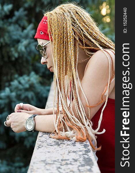 Late teenage girl with braids posing outdoors. Late teenage girl with braids posing outdoors