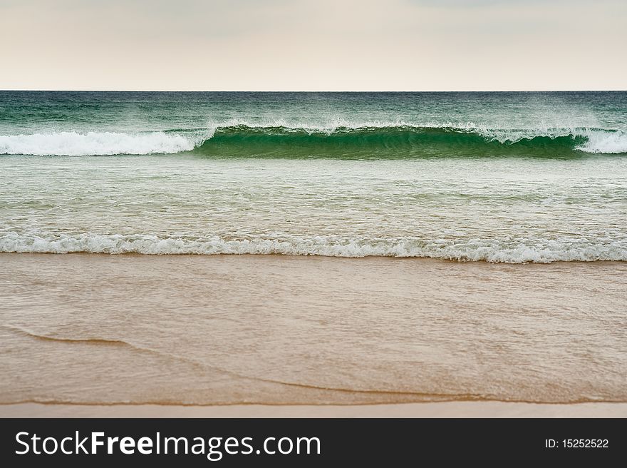 Waves on a coast in green