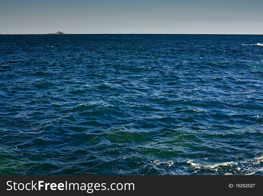 Ocean horizon with island