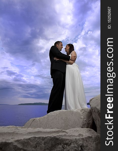 Wedding young nice couple by the sea, on their wedding day. Wedding young nice couple by the sea, on their wedding day