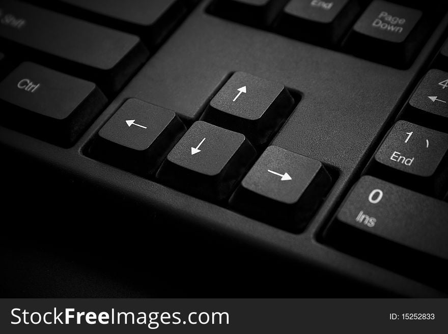 A close-up of arrow keys on a Keyboard.