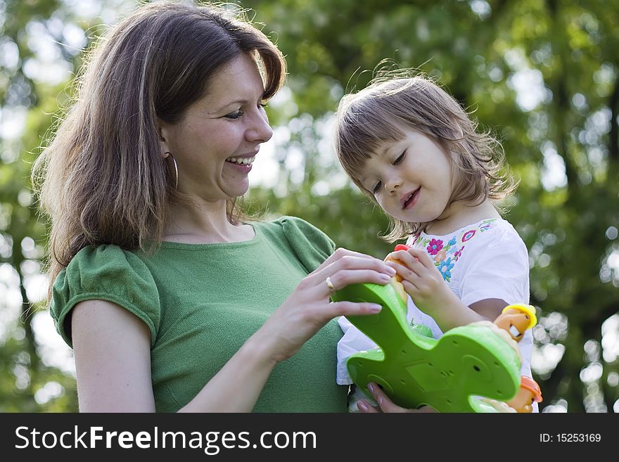 Beautiful Mother And Daughter Playing Together