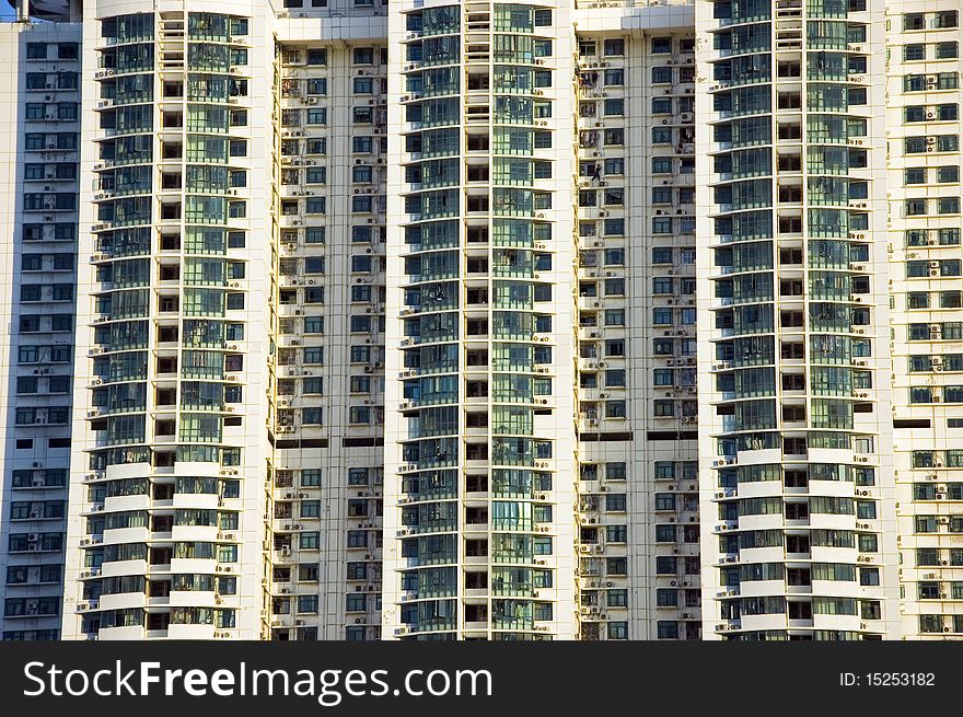 Residential buildings in China. Close up photo showing hundreds of apartments, windows and balconies.