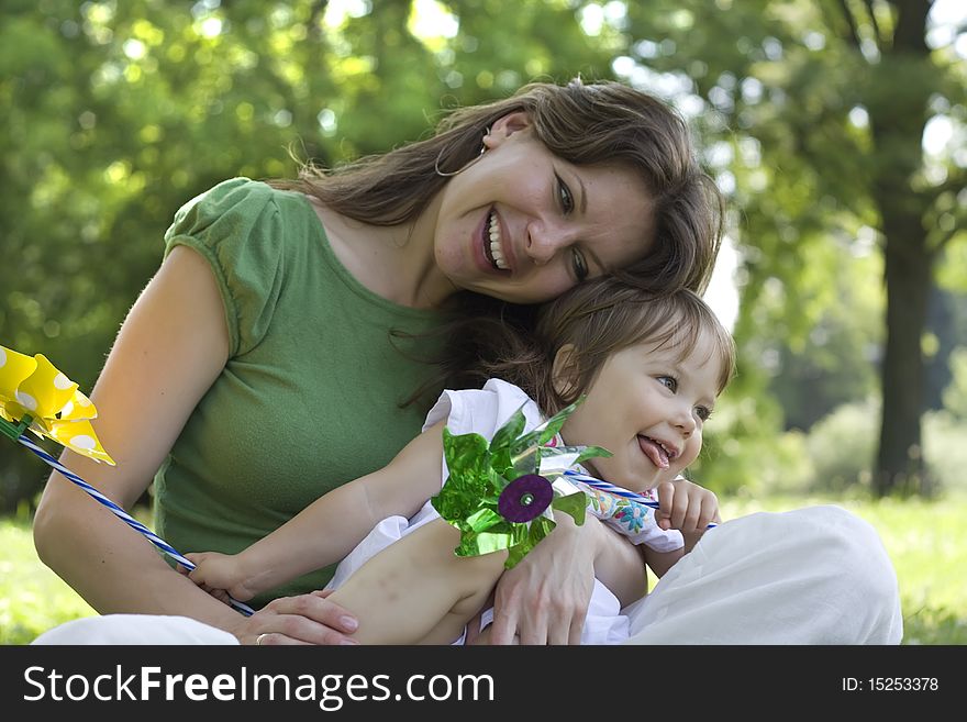 Mother and daughter in park together. Mother and daughter in park together