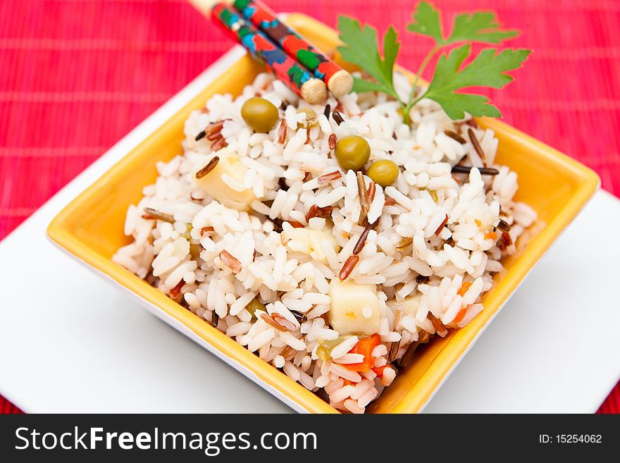 Asian rice salad on a bowl with vegetables