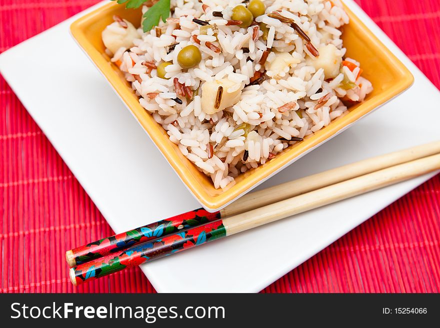 Asian rice salad on a bowl with vegetables