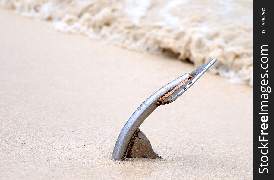 Anchor on the sand beach