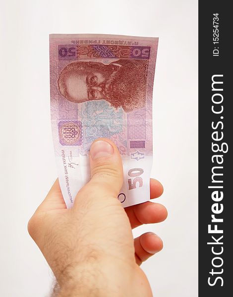 Ukrainian banknot hryvna in the mans hand. Ukrainian banknot hryvna in the mans hand