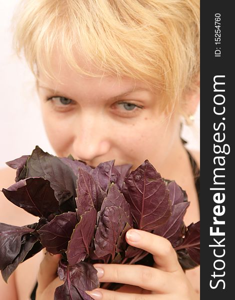 Beauty girl holding basil in hand. Beauty girl holding basil in hand