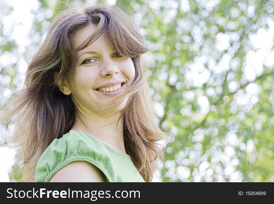 Friendly Young Woman Smiling Outdoors