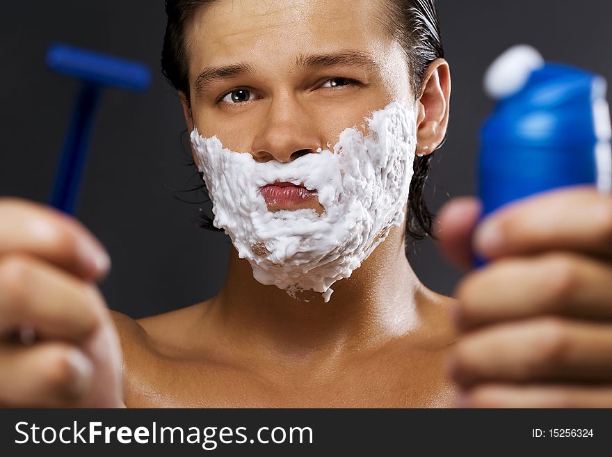 handsome young man with a shaving foam. handsome young man with a shaving foam
