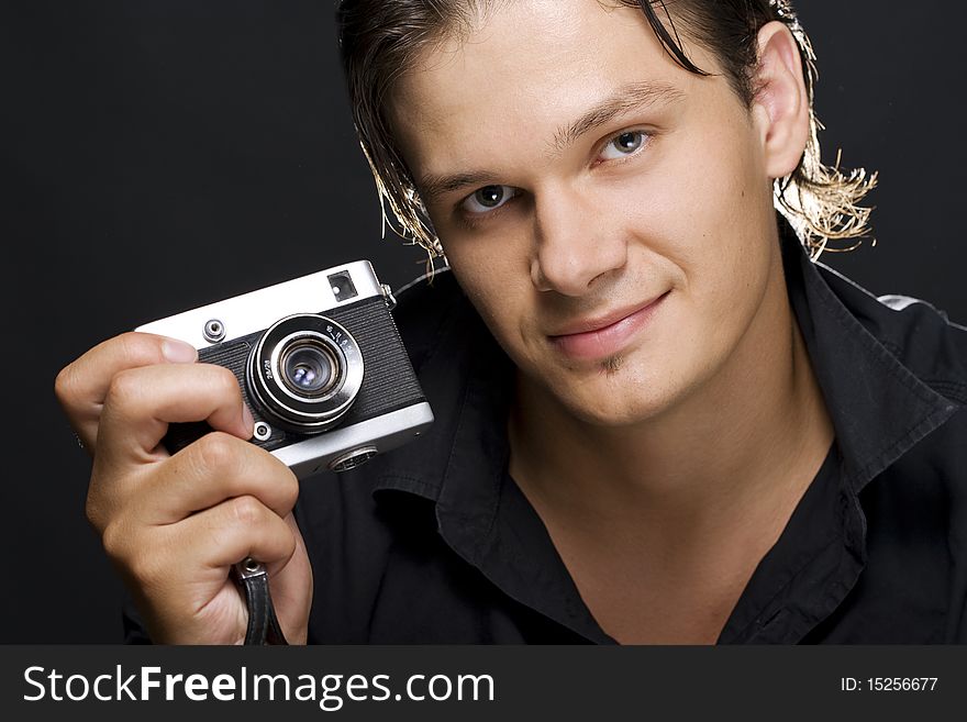 Man holding a photo camera. Man holding a photo camera