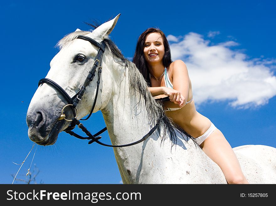 Young woman equestrian on horseback