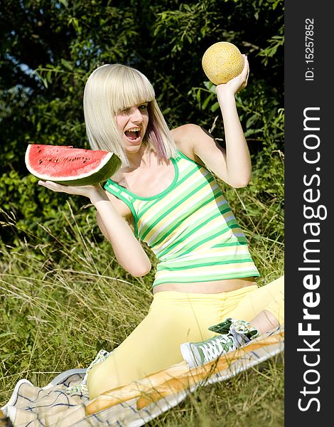 Woman with melons at a picnic. Woman with melons at a picnic