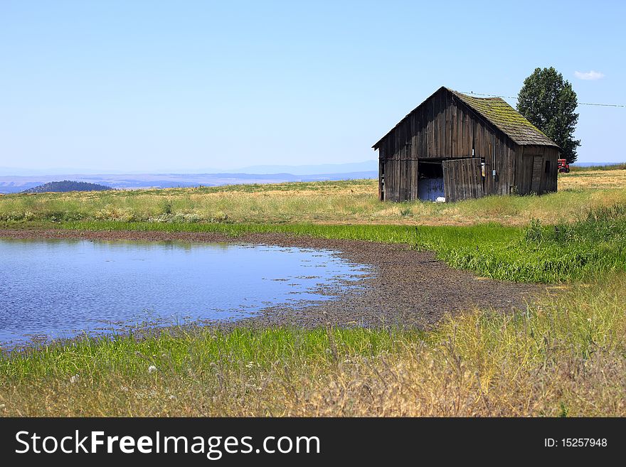 An old shack and a pond in eastern Washington state. An old shack and a pond in eastern Washington state.