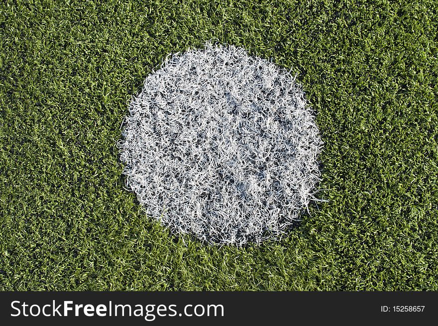 Soccer penalty kick on plastic grass