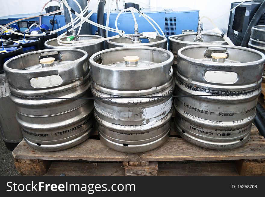 Steel indutrial barrels of beer stocked in storage