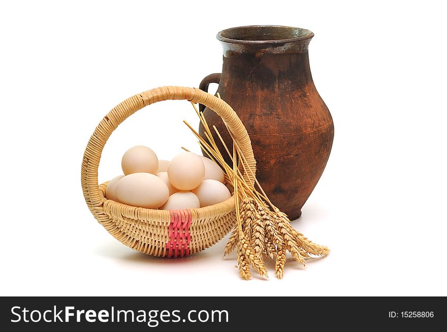 Milk, eggs and grain on white background