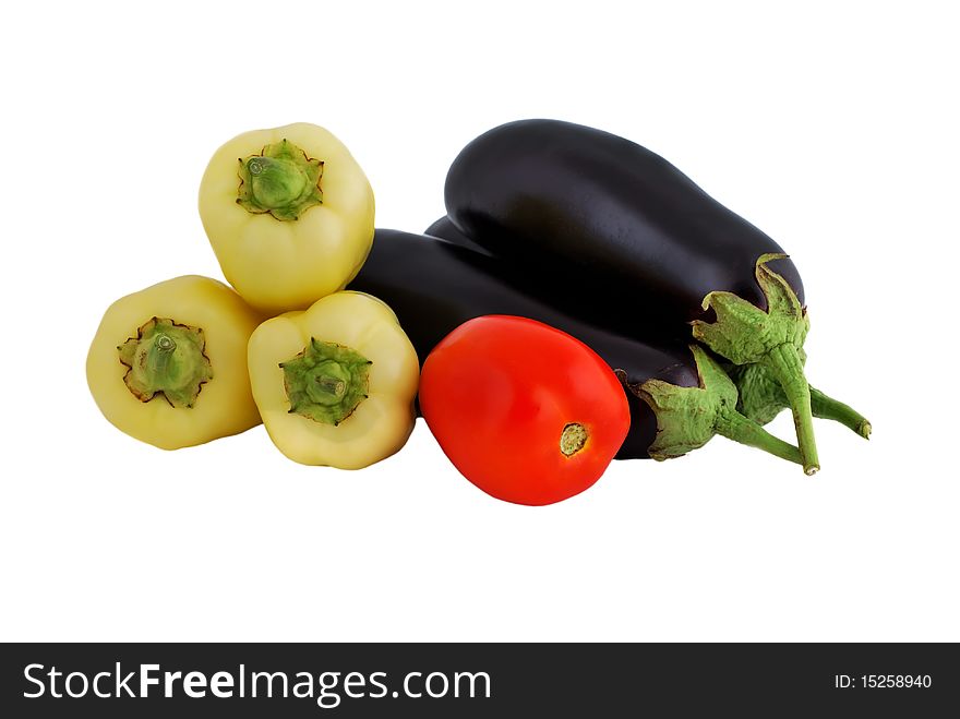 Vegetables: tomatoes, eggplant and peppers on a white background