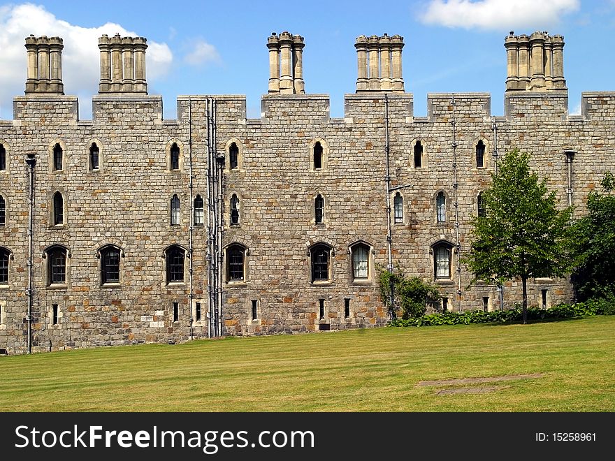 Windsor castle wall and green lawn, England