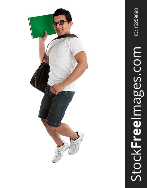 A happy smiling energetic jumping college student holding a book or textbook. White background. A happy smiling energetic jumping college student holding a book or textbook. White background.