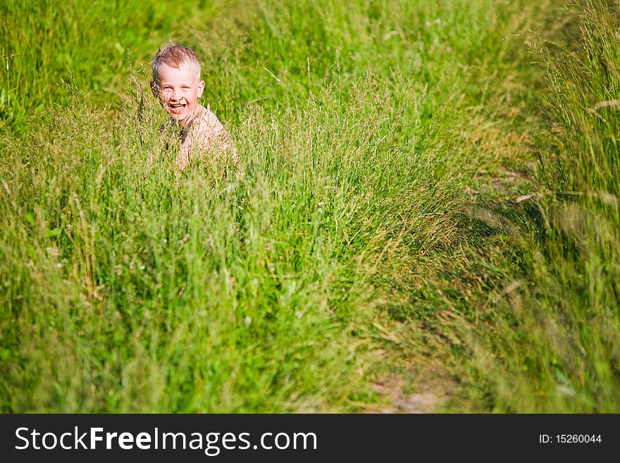 Boy in the field after bathing in the river. Boy in the field after bathing in the river