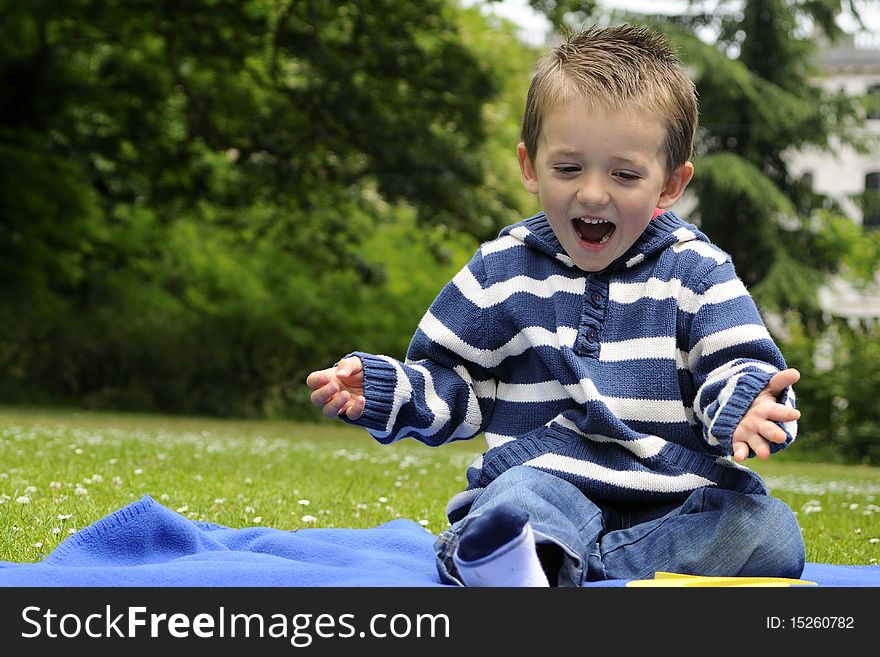 Cheerful white little boy relaxing in nature. Cheerful white little boy relaxing in nature
