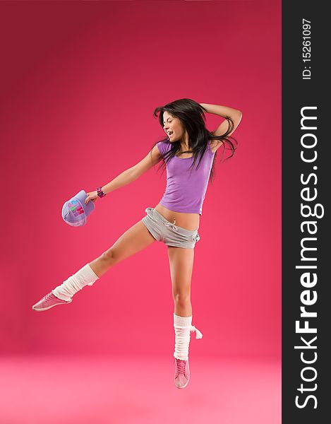 Hip hop dancer on the pink background