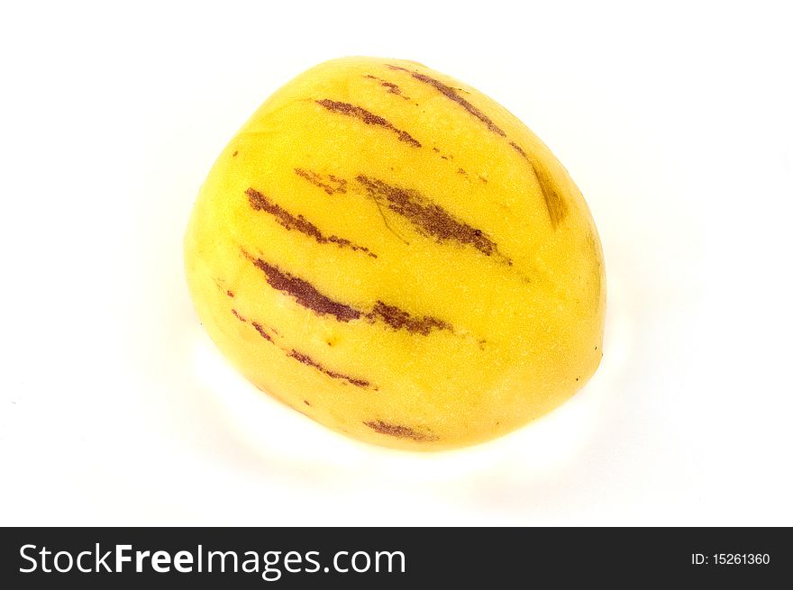 Single pepino tropical fruit isolated on white background