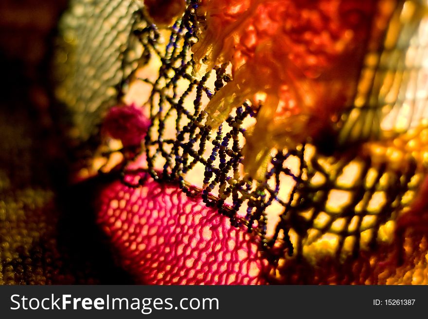 Abstract close-up of the hand made lighter. beads and beads, bright colors,  shallow depth of field.