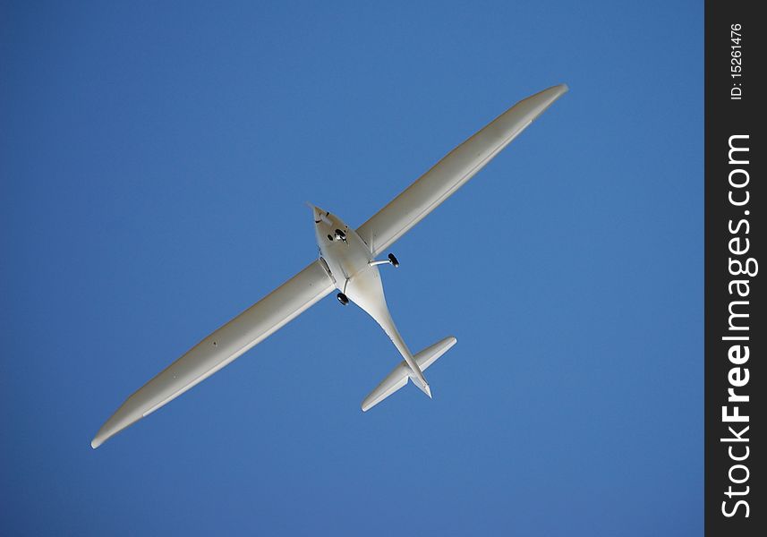 Glider hovering in the blue sky. Glider hovering in the blue sky