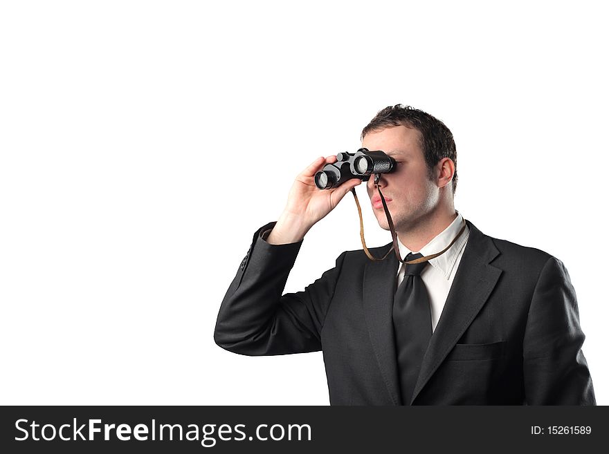 Young businessman looking through binoculars. Young businessman looking through binoculars