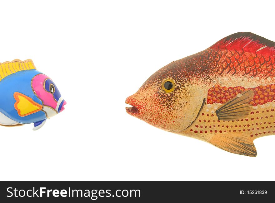 Two model fish face each other isolated against white