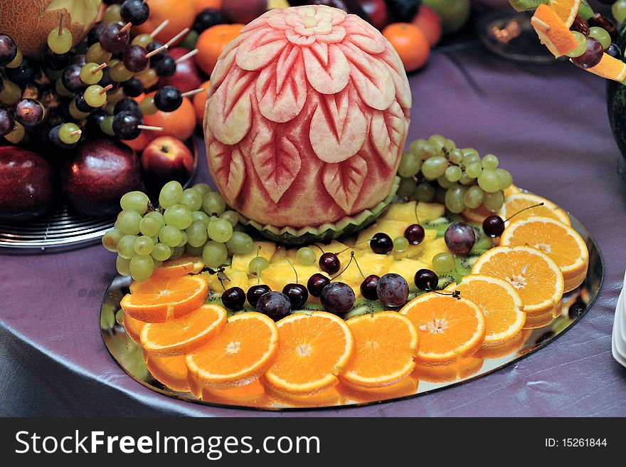 Fruit plate with bananas,kiwis, pineapples, apples, grapes