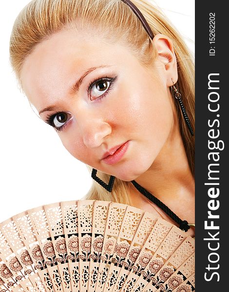 Portait of a young beautiful blond girl with a fan
