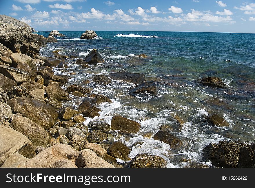 Rocky coastline of the Black sea in good summer weather. Rocky coastline of the Black sea in good summer weather